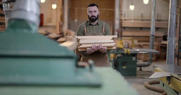 Man Working with Wood at the Joinery