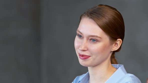 Young attentive woman listening to new project idea