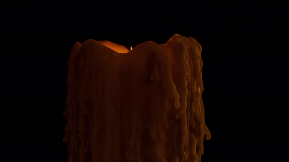 Time lapse of an old candle dripping wax as it burns