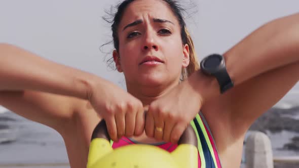 Caucasian woman working out on the docks