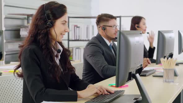 Business People Wearing Headset Working in Office