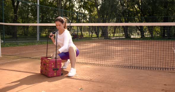 Woman Practise with Tennis Ball on Outdoor Court