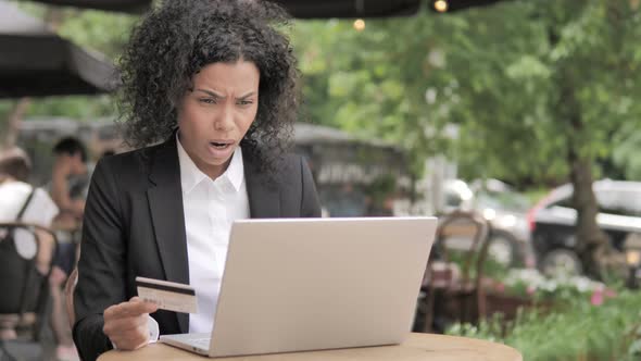 Online Shopping Failure for Young Woman Sitting on Bench