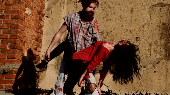 Slow Motion. Zombies Bloody Couple Dancing. Devil Man with Bloody Woman. Happy Halloween.