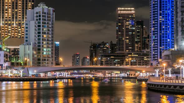 View of Dubai Marina Towers and Canal in Dubai Night Timelapse