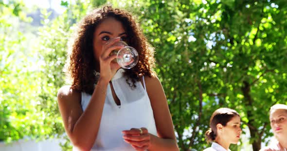 Woman having wine at restaurant