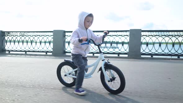 Cute 3 - 4 Years Boy Child Learning To Ride First Running Balance Bike.