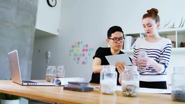 Business executives using digital tablet