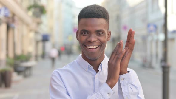 Happy African Man Clapping Outdoor Applauding