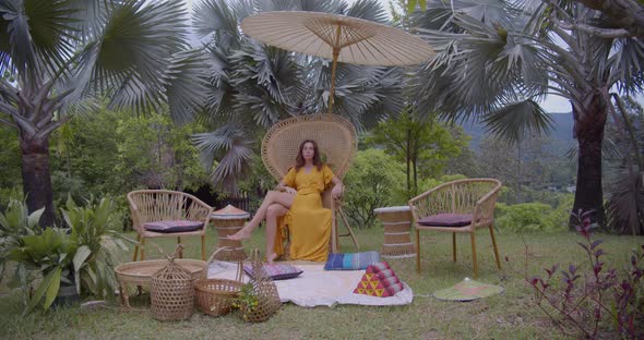 Sexy Slim Model Posing To the Camera, She Seats on the Chair During Picnic