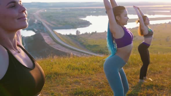 Fitness on Nature - Three Young Women Doing Yoga Exercises