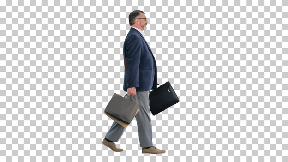 Senior business man walking with shopping bag, Alpha Channel