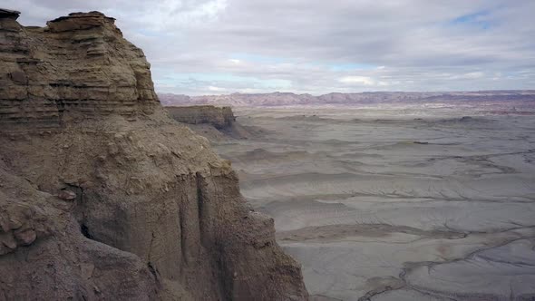 Decending down desert cliff viewing desert landscape