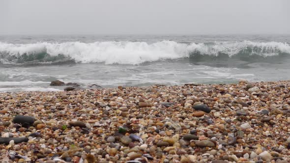 Beautiful Waves Foaming and Splashing on the Beach Sand