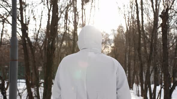 The Back of a Guy in a Protective Doctor's Suit