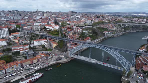 Porto city scene and Dom Luis I bridge. Portugal. Aerial flying backwards