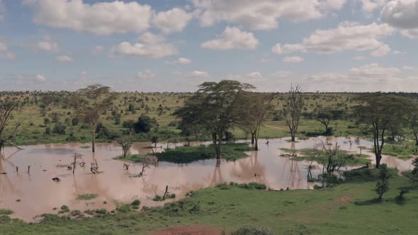 Waterhole lake in Laikipia, Kenya. Aerial drone view of Kenyan landscape