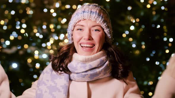 Happy Woman with Sparklers on Christmas in City