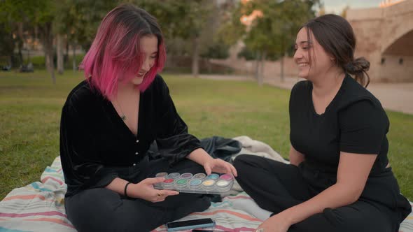 Pink and Brown Haired Girls Chatting and Laughing at the Park