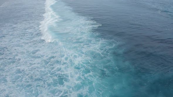 Sea Surface Mesmerizingly Lapping Waves on a Cloudy Summer Day