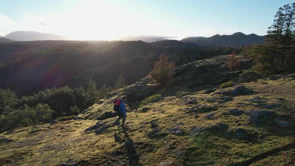 Aerial of a Male Hiker on a Rock Bluff Trail on Vancouver Island, Canada, Lone Tree Hill