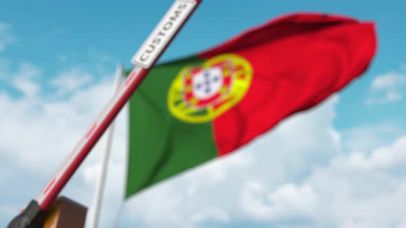 Closed Boom Gate with CUSTOMS Sign at the Portuguese Flag