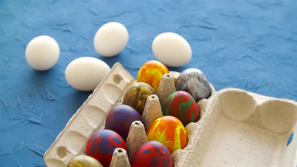 Colorful Easter Eggs on Blue Background. Easter Holiday Decorations Concept