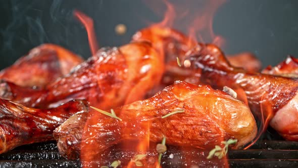 Super Slow Motion Shot of Seasoning Falling on Fresh Grilled Chicken Legs at 1000 Fps