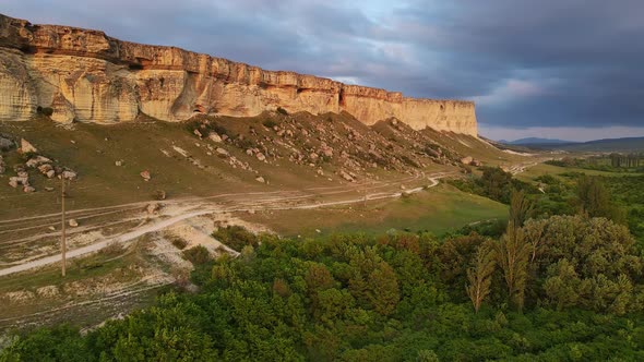 White Vertical Rocky Wall Rising Above the Valley