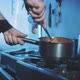 Hands of professional chef stirring meal - VideoHive Item for Sale