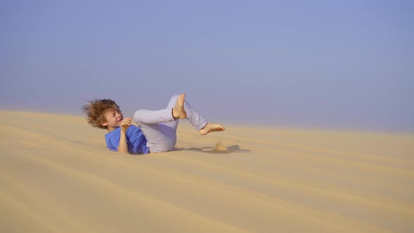 Little Boy is Having Fun in a Desert