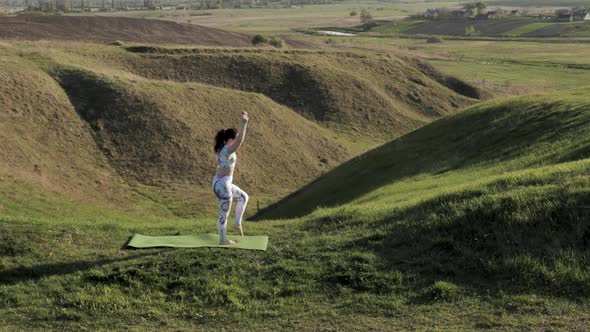 Woman Practicing Yoga in Nature alt