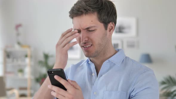 Young Man Shocked by Results on Phone