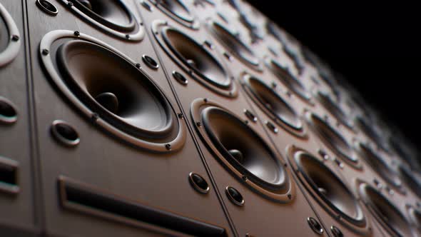 Modern speakers stacked in an endless wall loop. Membranes vibrate, studio mood.