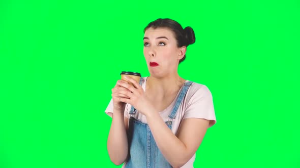 Girl Drinks Unpalatable Coffee and Is Disgusted on Green Screen, Slow Motion