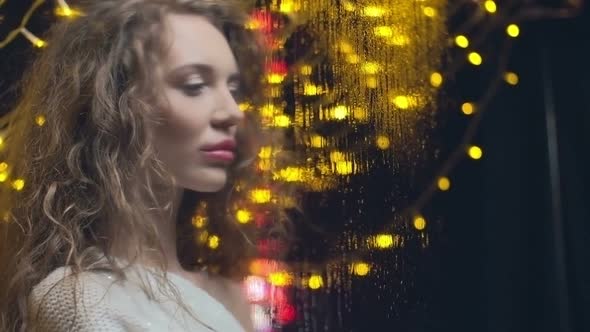 Young Woman Drawing on Foggy Glass