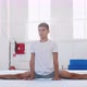 A teenager boy is making a front split in front of the camera. - VideoHive Item for Sale