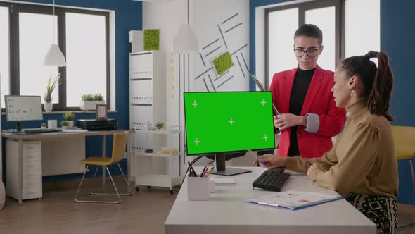 Business People Working with Green Screen on Monitor