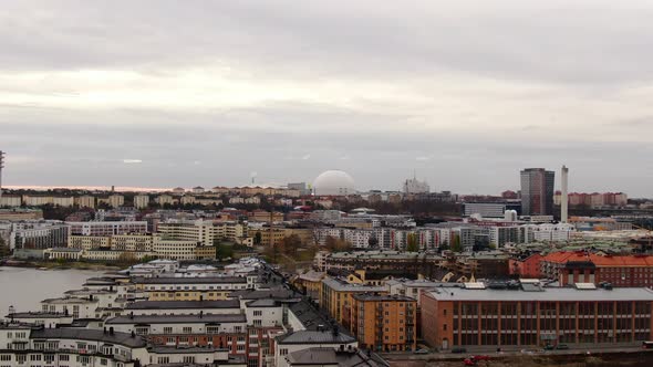 Aerial over Stockholm river pushing in towards southern skyline