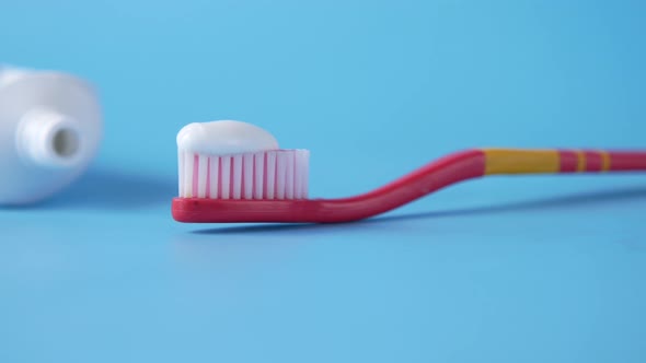 Tooth Brush and Paste on Blue