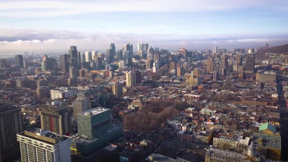 Cinematic drone shot flying into a modern urban city.