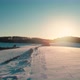 Aerial Drone View of a Fields Covered with Winter Snow during Sunset - VideoHive Item for Sale