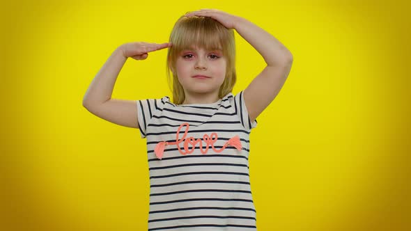 Responsible Teen Child Kid Girl Giving Salute Listening to Order As If Soldier Following Discipline