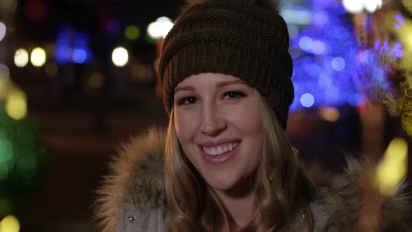 Young woman smiling and looking down