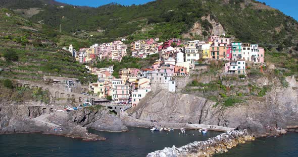 Epic hillside coastal village overlooking Mediterranean Sea, Manarola, Italy