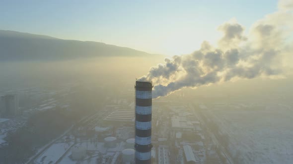 Cityscape Silhouette with Clouds of Smoke From Smoking Chimneys