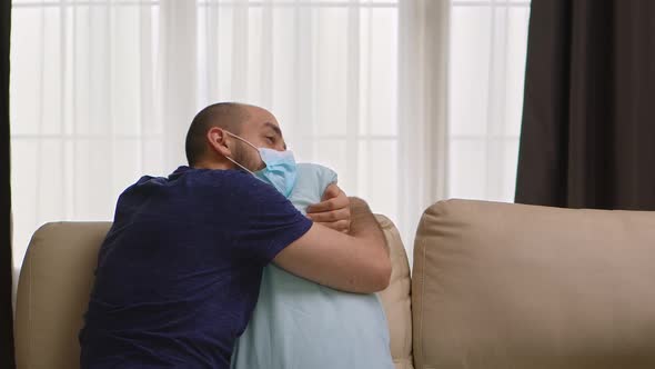 Depressed Man with Protection Mask Against Covid-19