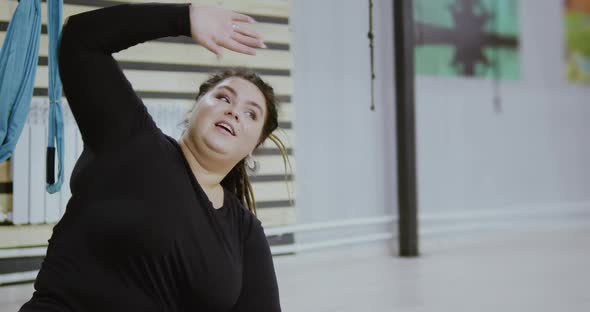 Happy Body Positive Woman Smiling and Laughing After Doing Stretching Exercise on Hammocks