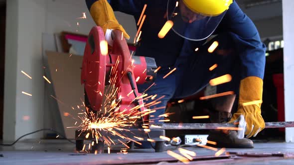 Professional Mechanic is Cutting Steel Metal