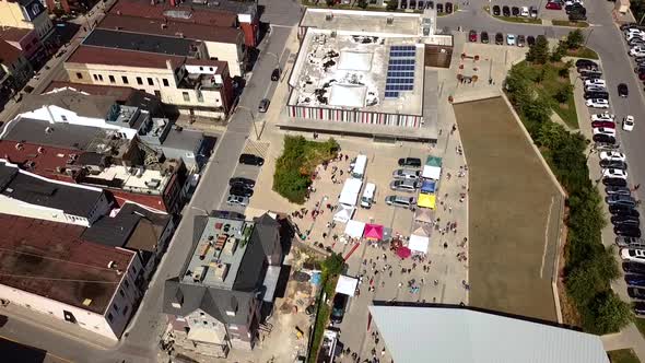 Aerial view of a street festival in a small town centre.